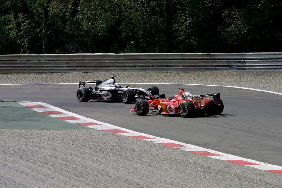 057 | 2004 | Monza | McLaren-Mercedes Benz MP4-19B | David Coulthard + Ferrari F2004 | Michael Schumacher | © carsten riede fotografie